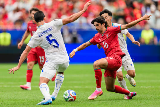 Rustam Ashurmatov of Uzbekistan and Francisco Trincao of