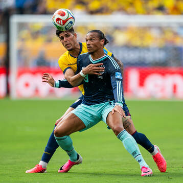 Piero Hincapie of Ecuador and Leroy Sane of Germany