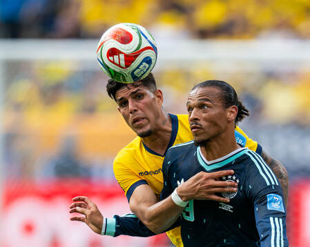Piero Hincapie of Ecuador and Leroy Sane of Germany