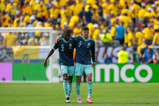 Antonio Ruediger and Kai Havertz looks dejected