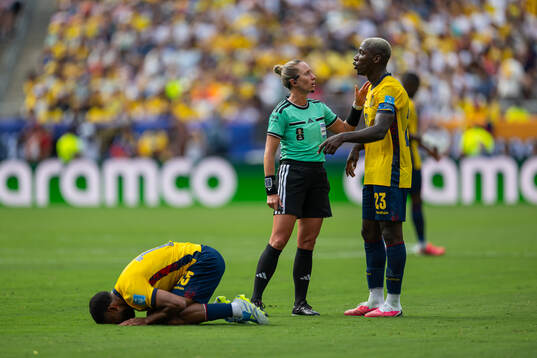Pedro Vite, Moises Caicedo of Ecuador and referee Tori Penso