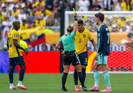 Piero Hincapie of Ecuador receives a warning from referee