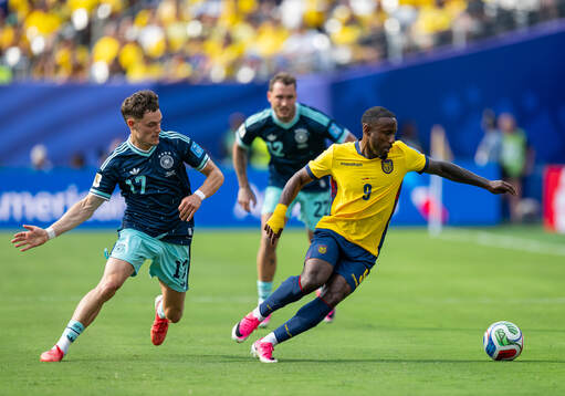 Florian Wirtz of Germany and John Yeboah of Ecuador