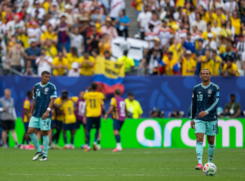 Malick Thiaw and Leroy Sane of Germany look dejected