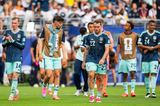 Maximilian Beier and David Raum of Germany look dejected