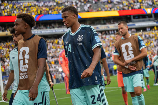 Lennart Karl and Malick Thiaw of Germany looks dejected