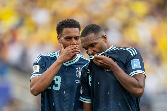Felix Nmecha and Jonathan Tah of Germany look dejected