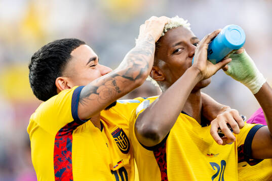Kendry Paez and Nilson Angulo of Ecuador celebrate