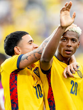 Kendry Paez and Nilson Angulo of Ecuador celebrate
