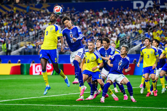 Alexander Isak of Sweden and Daichi Kamada of Japan