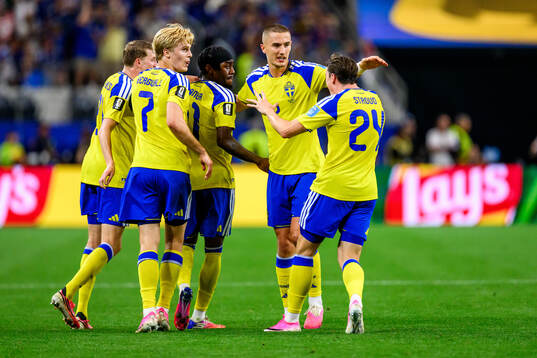 Anthony Elanga of Sweden celebrates scoring 1-1