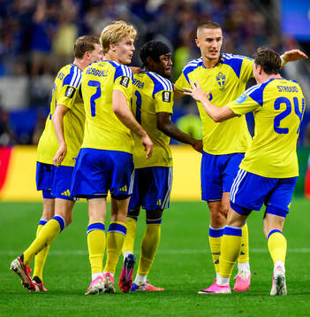 Anthony Elanga of Sweden celebrates scoring 1-1
