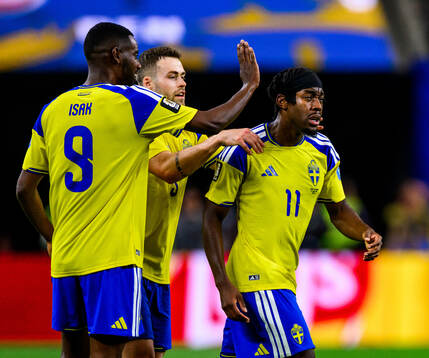 Anthony Elanga of Sweden celebrates scoring 1-1