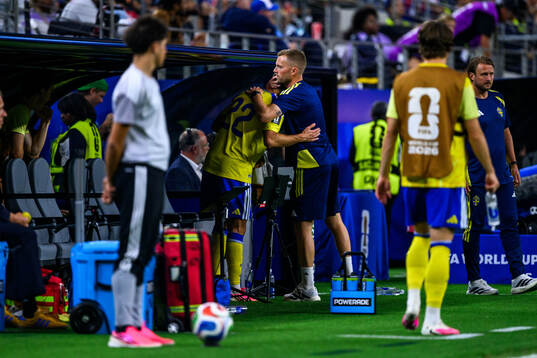 Besfort Zeneli and assistant coach Sebastian Larsson of