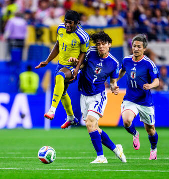Anthony Elanga of Sweden and Ao Tanaka of Japan