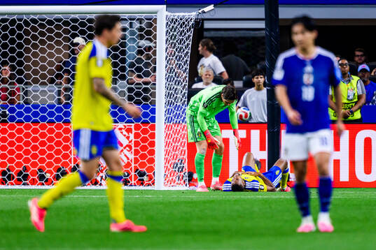 Goalkeeper Jacob Widell Zetterström and Isak Hien of Sweden