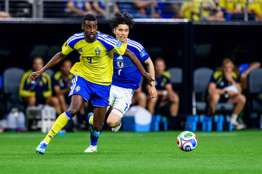 Alexander Isak of Sweden and Ao Tanaka of Japan