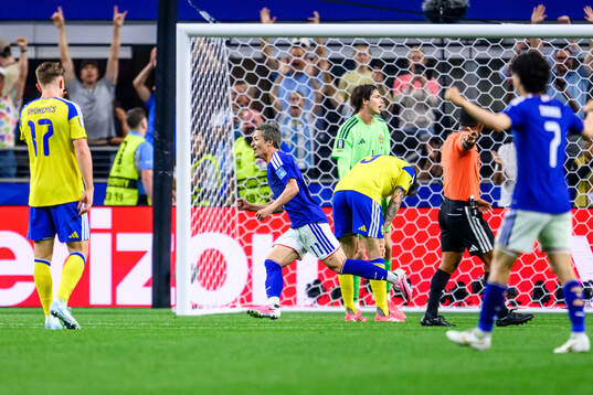 Daizen Maeda of Japan celebrates 1-0