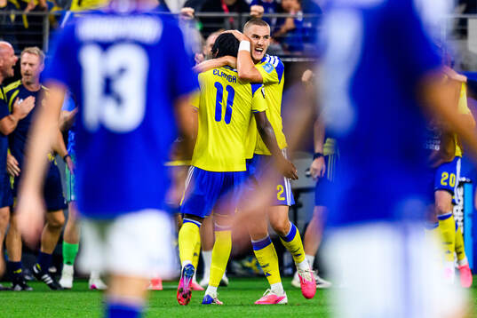 Gustaf Lagerbielke and Anthony Elanga of Sweden celebrate