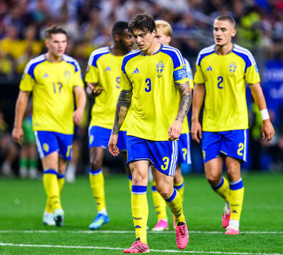 Victor Nilsson Lindelöf of Sweden looks dejected