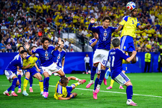 Daichi Kamada of Japan and Alexander Isak of Sweden