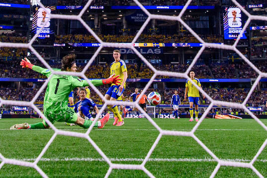 Daizen Maeda of Japan scores 1-0 behind goalkeeper Jacob