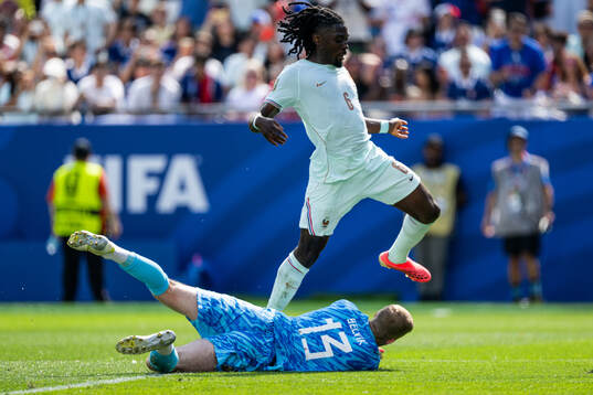 Goalkeeper Egil Selvik of Norway and Manu Kone of France