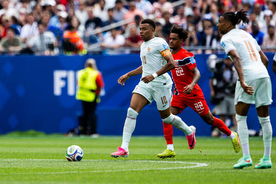 Kylian Mbappe of France and Oscar Bobb of Norway