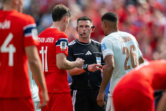 Jørgen Strand Larsen of Norway, Referee Michael Oliver and