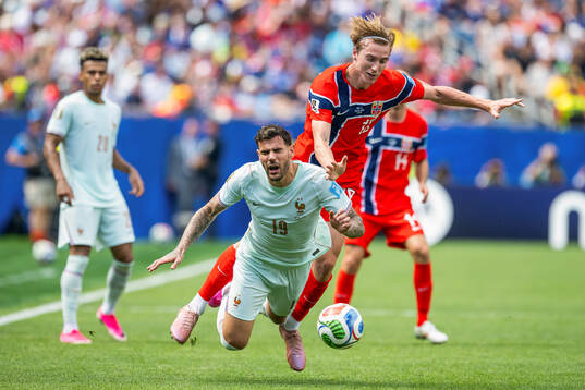 Theo Hernandez of France and Kristian Thorstvedt of Norway