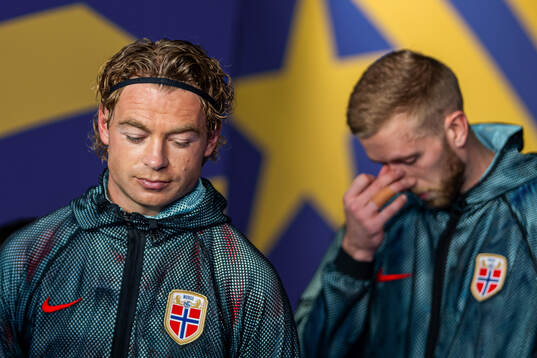 Patrick Berg and goalkeeper Egil Selvik of Norway
