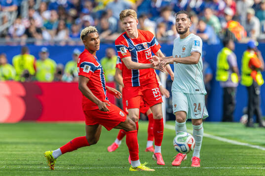 Jens Petter Hauge of Norway and Rayan Cherki of France