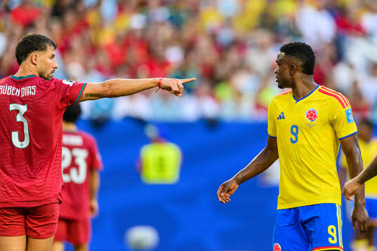 Ruben Dias of Portugal and Jhon Cordoba of Colombia