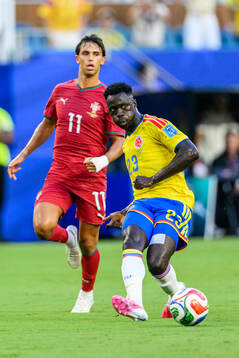 Joao Felix of Portugal and Davinson Sanchez of Colombia