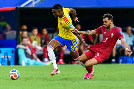 Jhon Cordoba of Colombia and Bruno Fernandes of Portugal