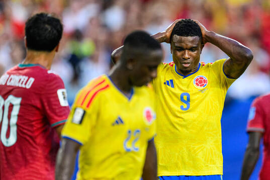 Jhon Cordoba of Colombia looks dejected