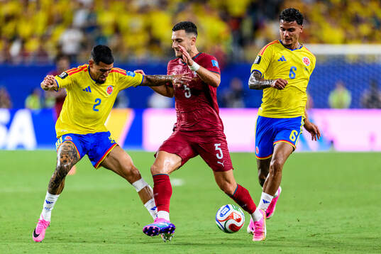 Daniel Munoz and Richard Rios of Colombia and Diogo Dalot