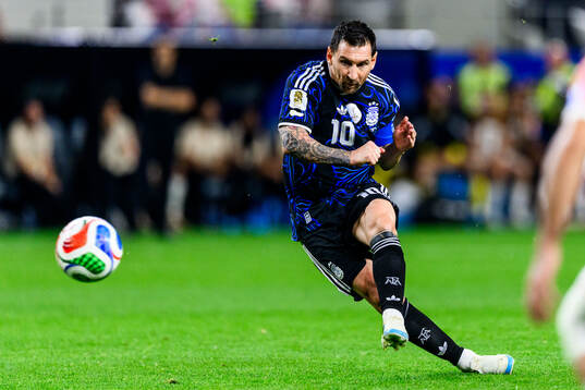 Lionel Messi of Argentina scores the 1-3 goal
