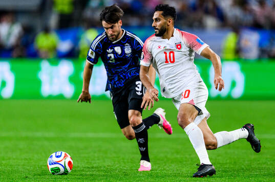 Nicolas Tagliafico of Argentina and Mousa Altamari of Jordan