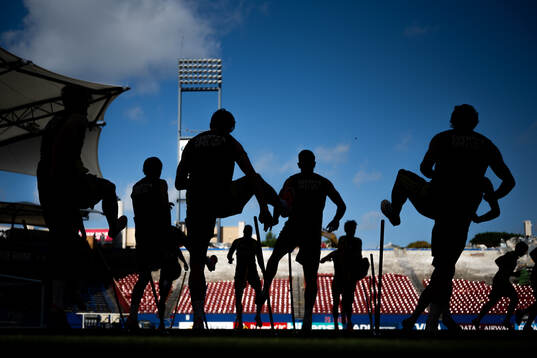 Players of the Swedish national football team in silhouette
