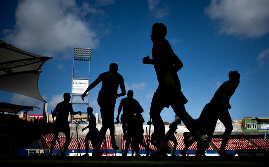 Players of the Swedish national football team in silhouette