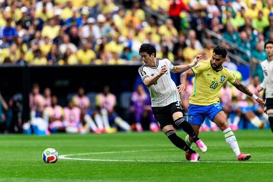Shogo Taniguchi of Japan and Lucas Paqueta of Brazil