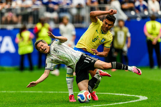 Daizen Maeda of Japan and Casemiro of Brazil