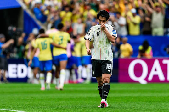 Ayase Ueda of Japan looks dejected