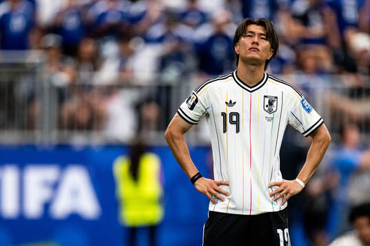 Koki Ogawa of Japan looks dejected