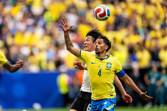 Wataru Endo of Japan and Marquinhos of Brazil
