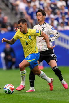 Bruno Guimaraes of Brazil and Daichi Kamada of Japan