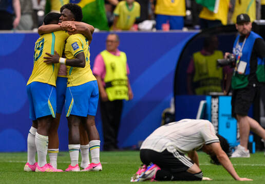 Endrick and Vinicius Junior of Brazil celebrates while a
