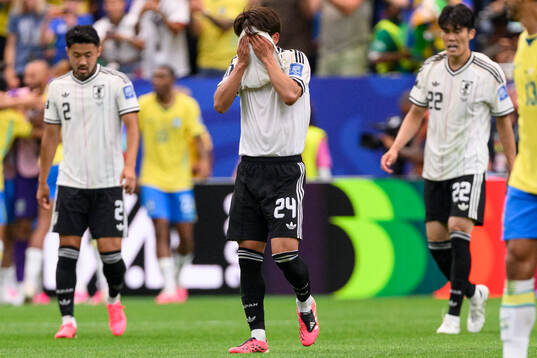 Kaishu Sano of Japan looks dejected