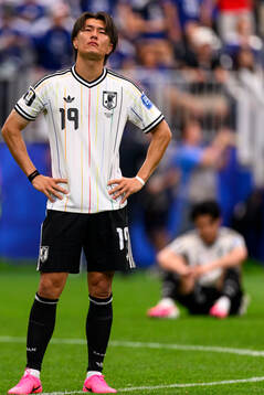 Koki Ogawa of Japan looks dejected